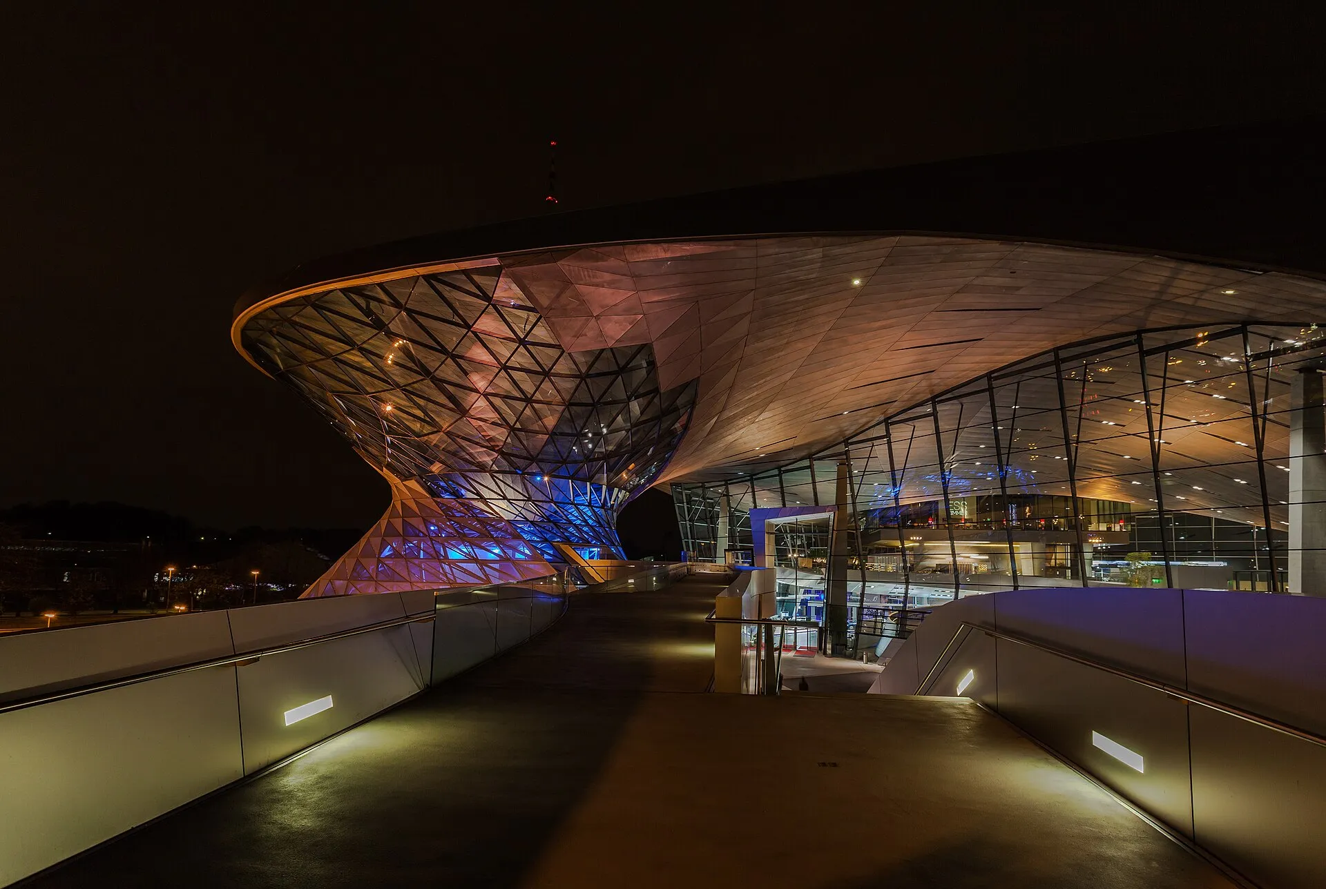 The swooping glass-and-steel double-cone facade of BMW Welt, the automaker's exhibition center in Munich, Germany.