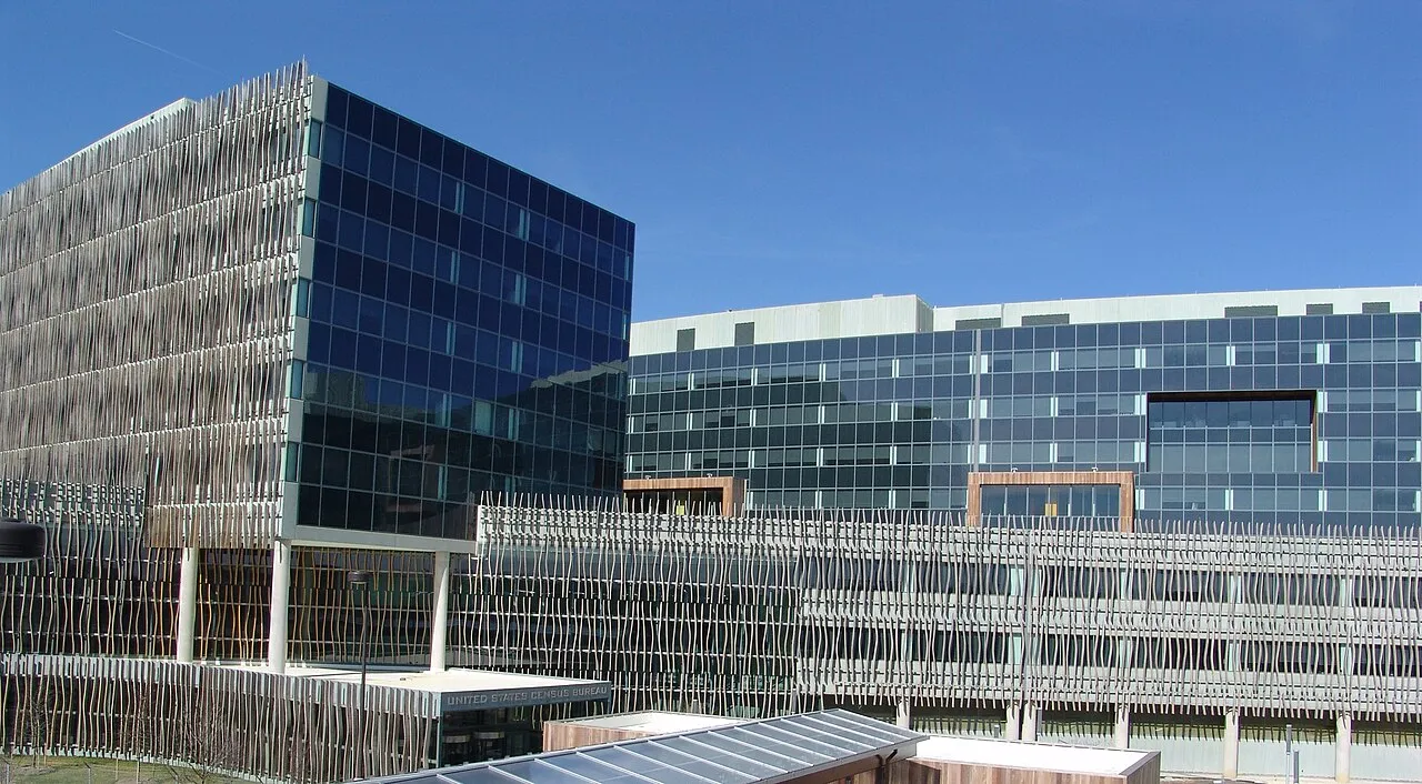 The U.S. Census Bureau headquarters, a long low glass-and-metal office building in Suitland, Maryland.