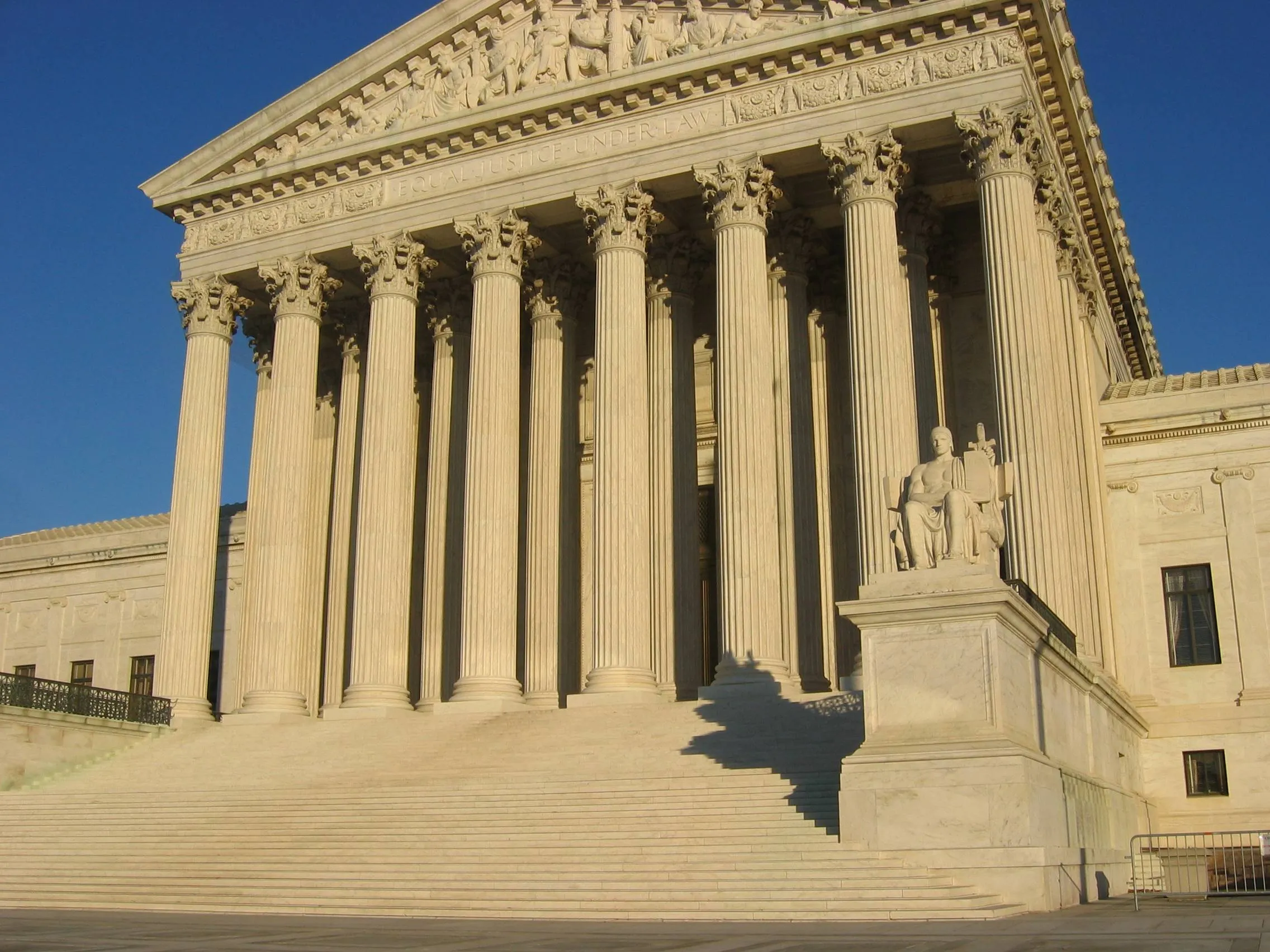 The west facade of the U.S. Supreme Court building in Washington, with its marble columns and front steps.