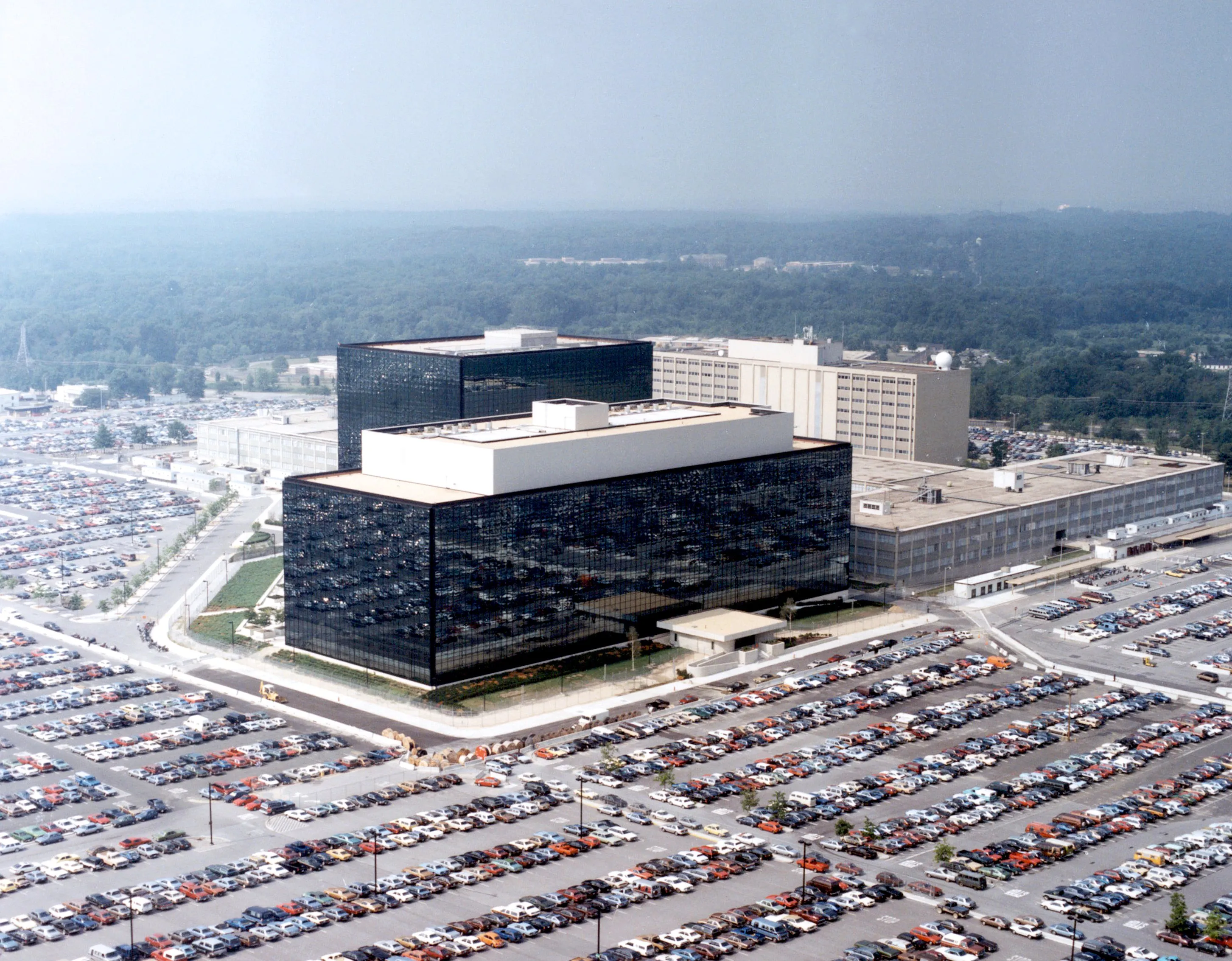 An aerial view of the National Security Agency headquarters complex and parking lots at Fort Meade, Maryland.