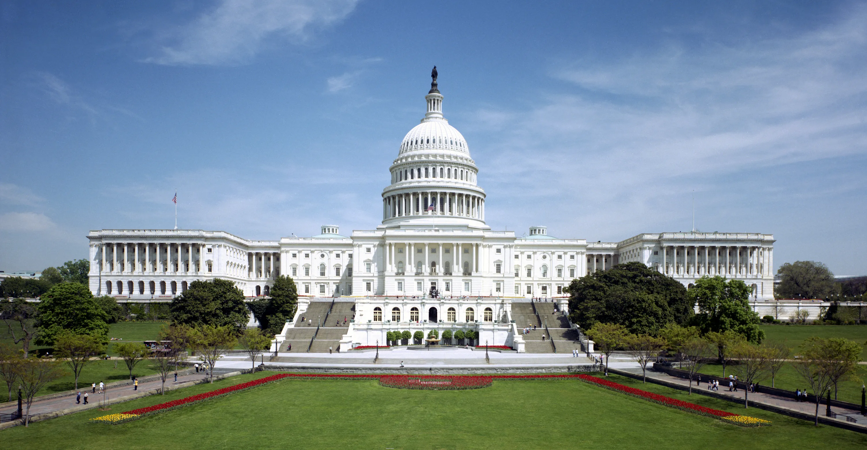 The west front of the United States Capitol building beneath a clear sky