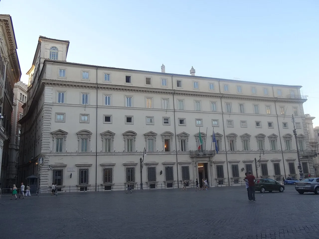 Palazzo Chigi, a Renaissance-era stone palace that houses the Italian government, seen from a street in Rome.