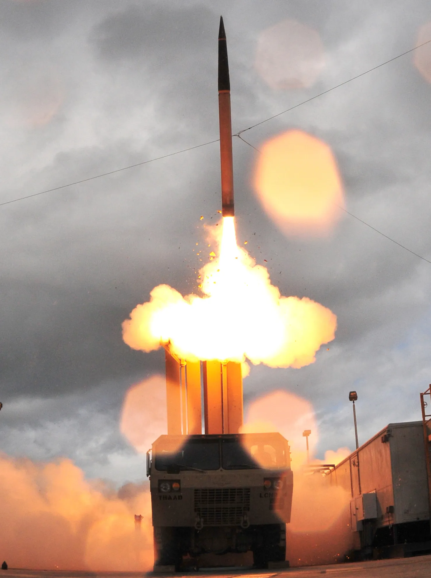 A THAAD interceptor missile launches from its mobile ground platform during a 2008 flight test, leaving a bright exhaust trail against a blue sky