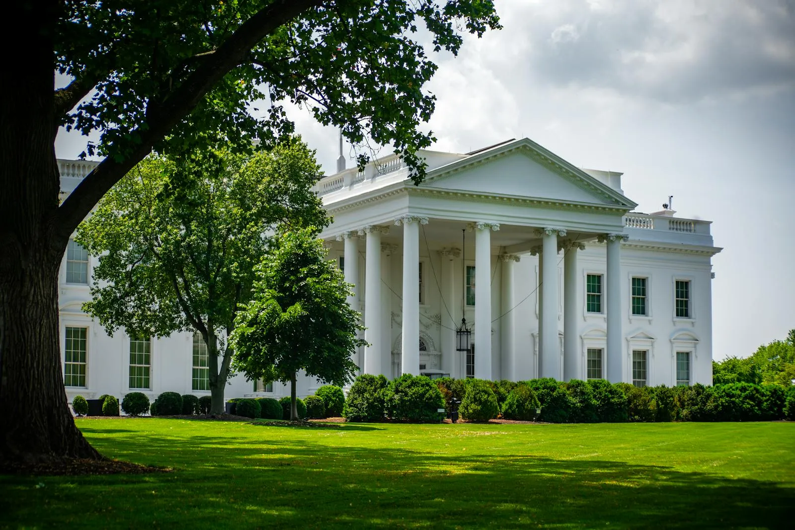 The White House North Lawn framed by summer trees in Washington, D.C.