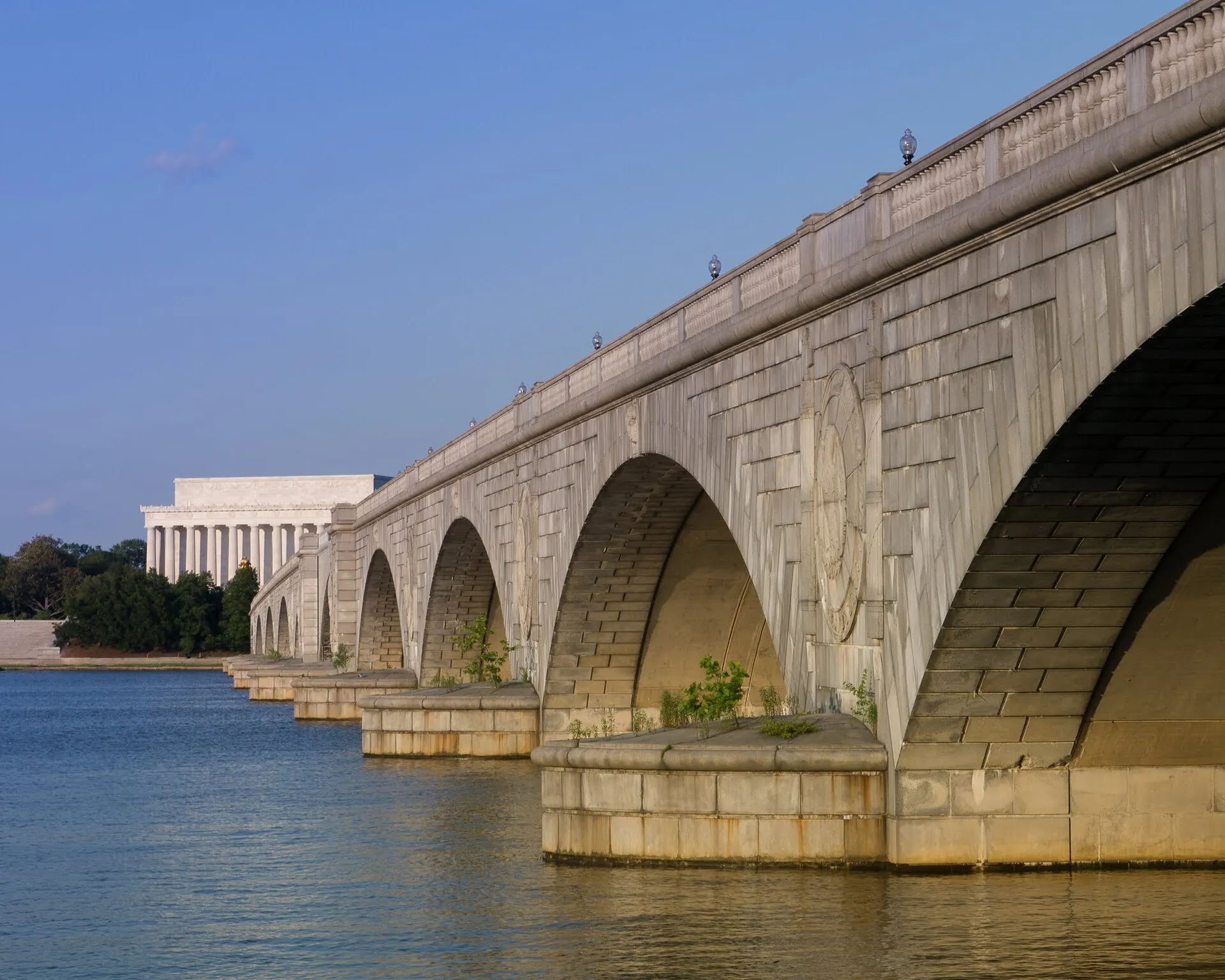 Arlington Memorial Bridge spanning the Potomac River, photographed from the Virginia shore near Memorial Circle.