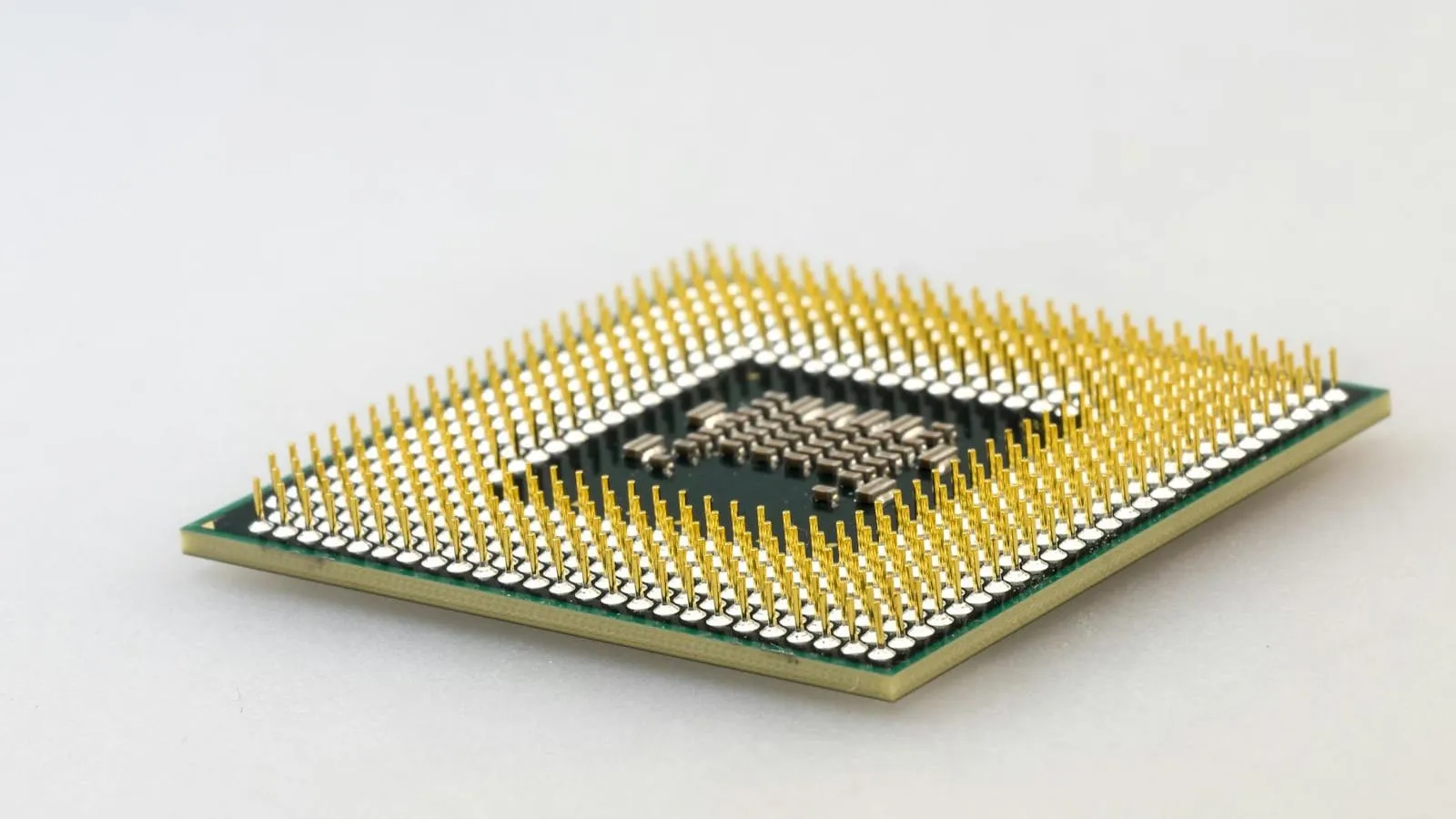 Macro photograph of a computer processor chip on a circuit board.