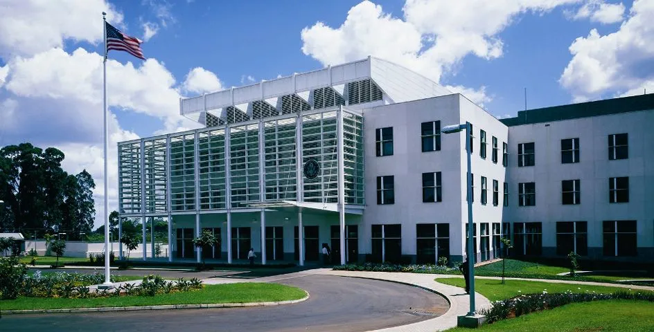 The United States Embassy compound in Nairobi, Kenya, with the U.S. seal and flag at the entrance.